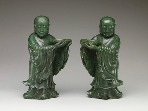 Green jade temple attendant carvings.