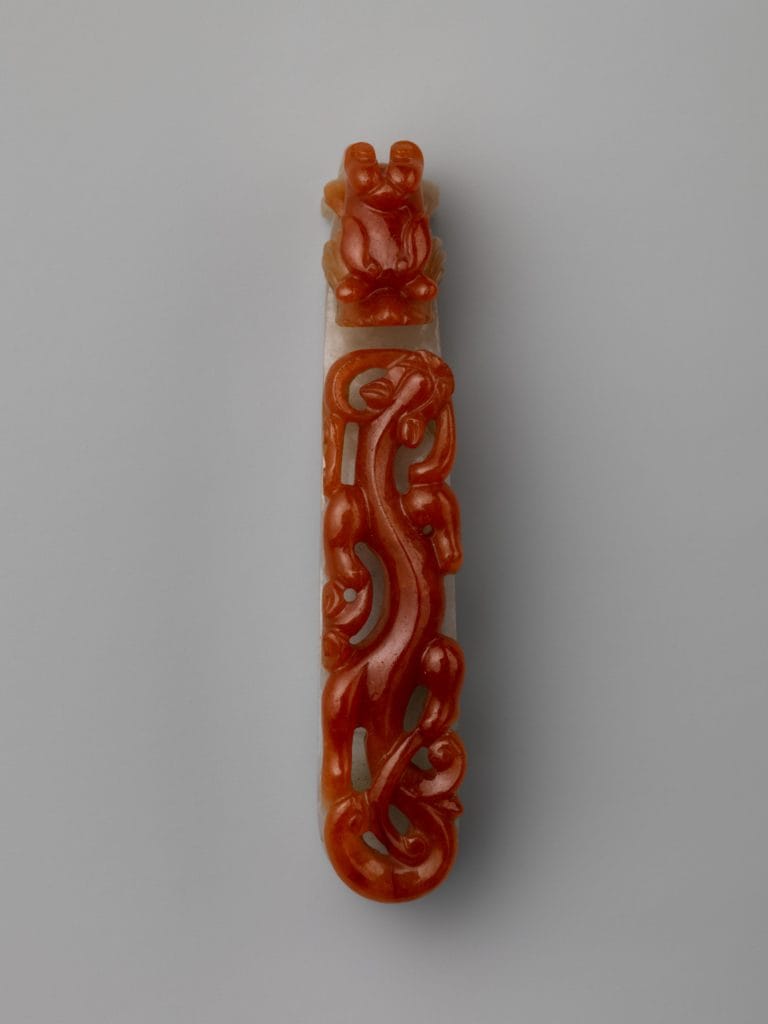 A green and red Qing dynasty era carving. Shows the stark contrast colors can be from a single piece of jade.